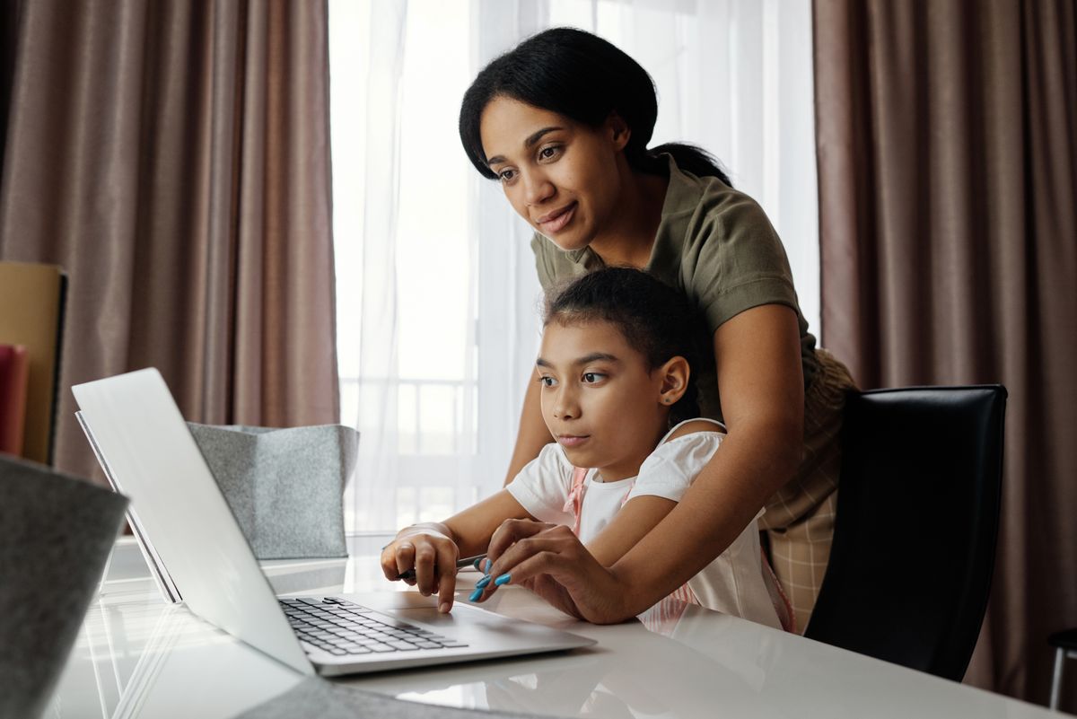 Mother supporting her child with family-centered health resources